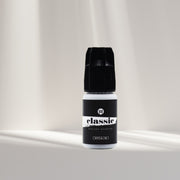 Bottle of I AM Lash Professional Classic Eyelash Extension Glue, eyelash adhesive for professional lash extensions.