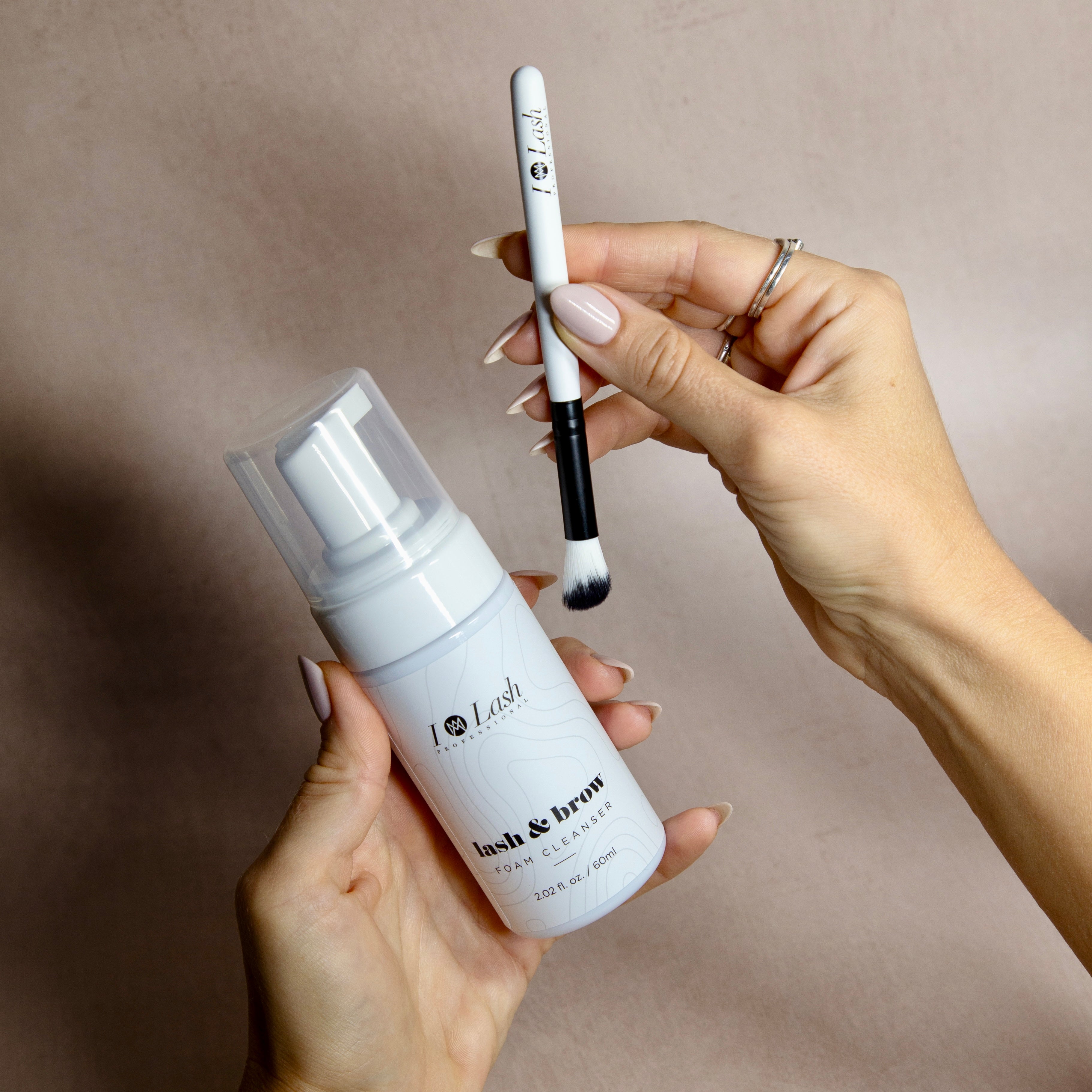 Eyelash foam cleanser and cleansing brush. Eyelash extensions aftercare. 