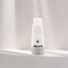 Sheer clear eyelash extension glue from I AM Lash Professional, showing the adhesive bottle used for eyelash extensions.