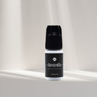 Touch Eyelash Extension Glue from I AM Lash Professional, a clear eyelash adhesive bottle with applicator tip.