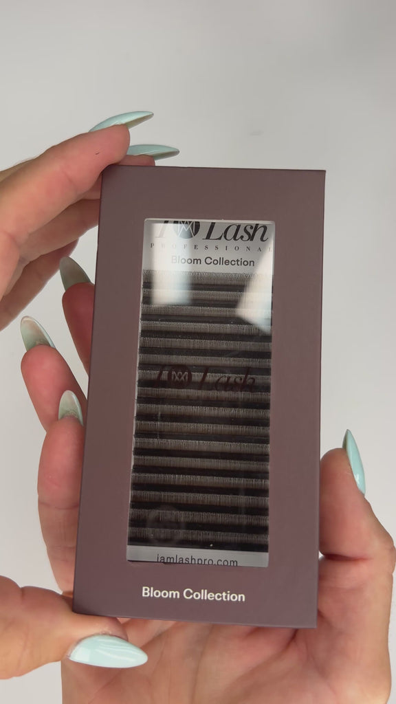 Video of the Bloom Collection 3DW Brown pre-made lash fan tray being opened to show the mixed-length rows of warm brown 3D volume fans inside.